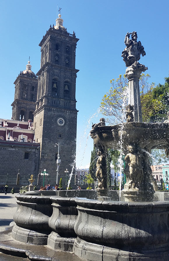 Church and fountain in Puebla